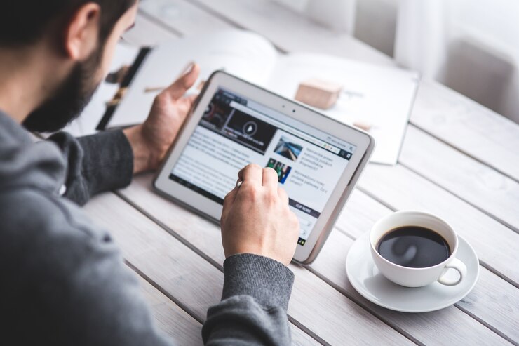 worker-reading-news-with-tablet_1162-83